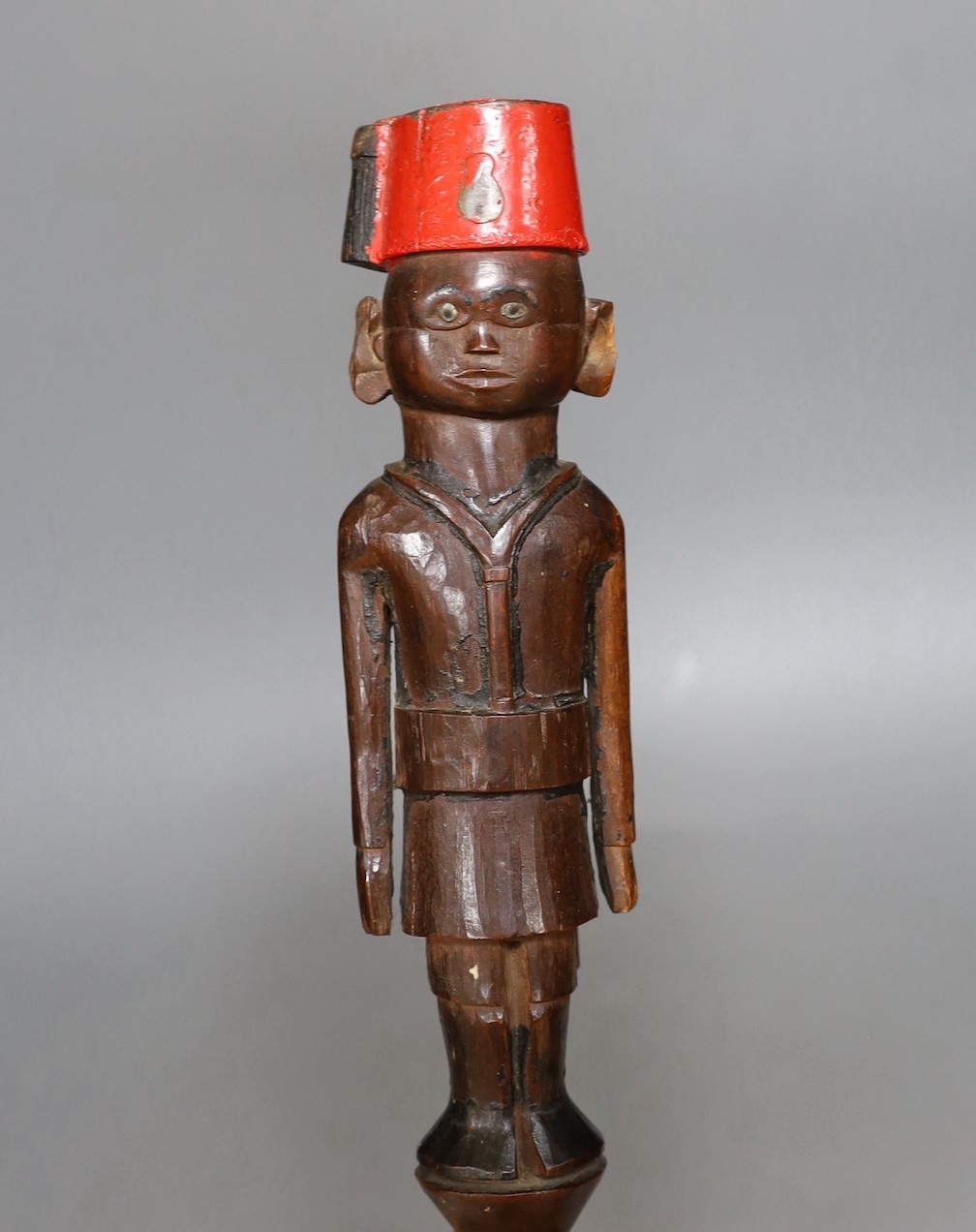 An early 20th century Nyassaland figural carved walking cane (Kings African Rifles) 87cm long